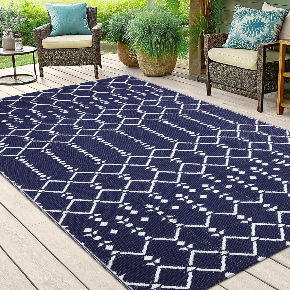 Smiry Outdoor Rug being cleaned with a hose