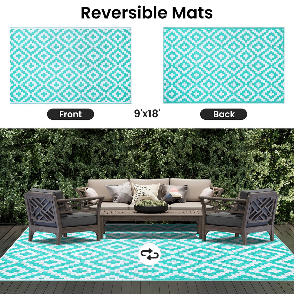 Smiry Outdoor Rug displayed on a patio