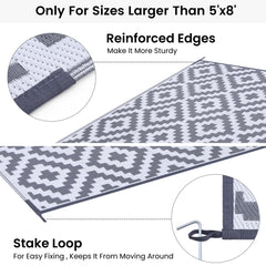 Smiry Outdoor Rug placed on patio with furniture