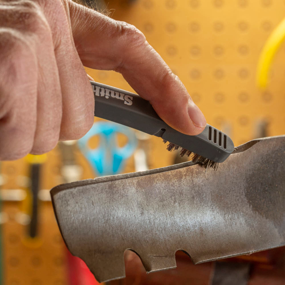 Smith's Lawn Mower Blade Sharpener in use on a mower blade