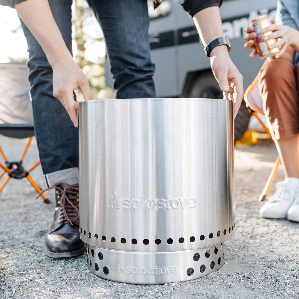Solo Stove Ranger Stand in use on a patio with a fire pit