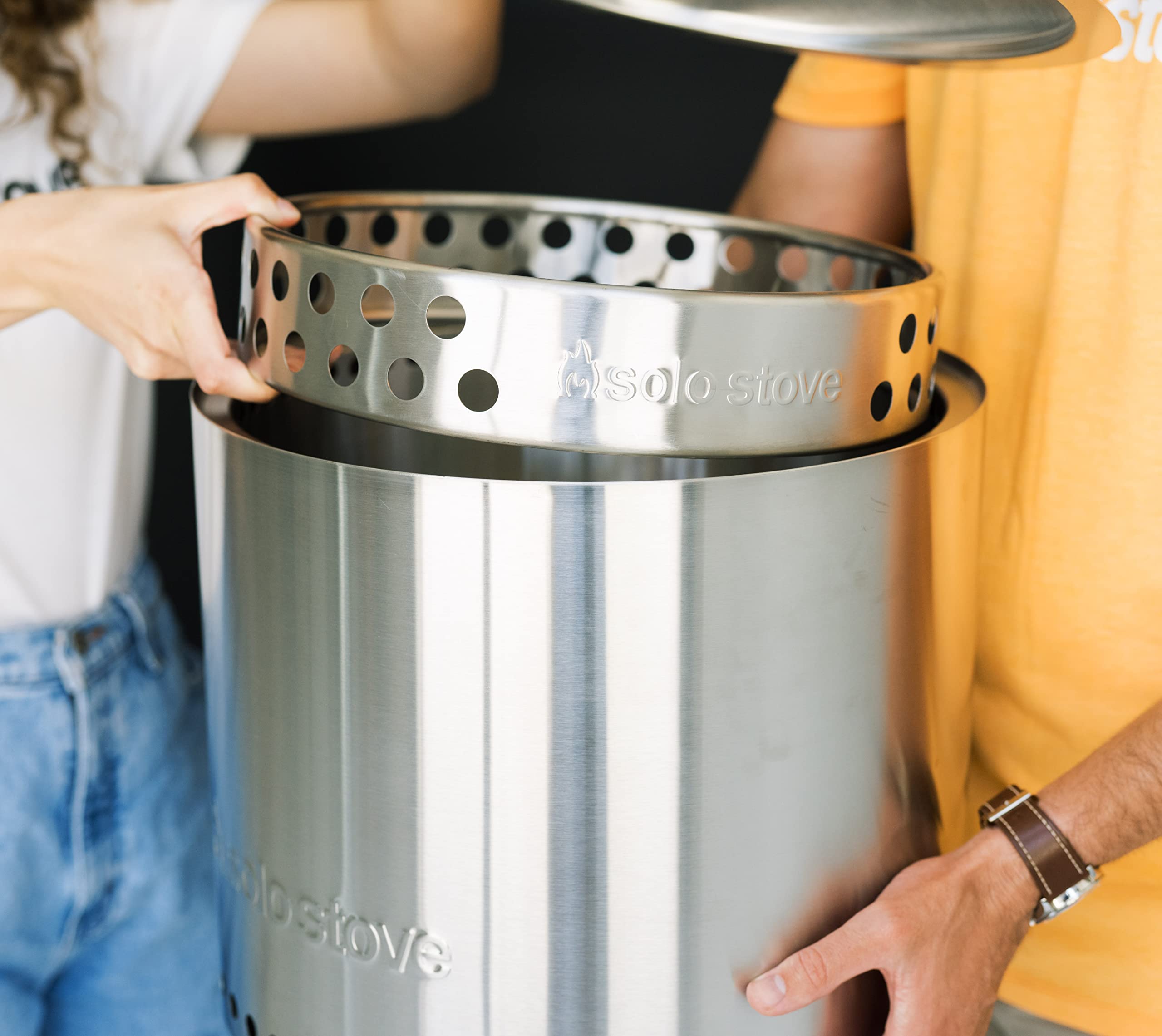 Solo Stove Ranger Stand next to camping gear outdoors
