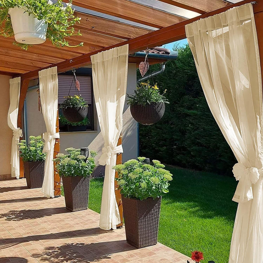 SpaceDresser Outdoor Sheer Curtain beige hanging on patio