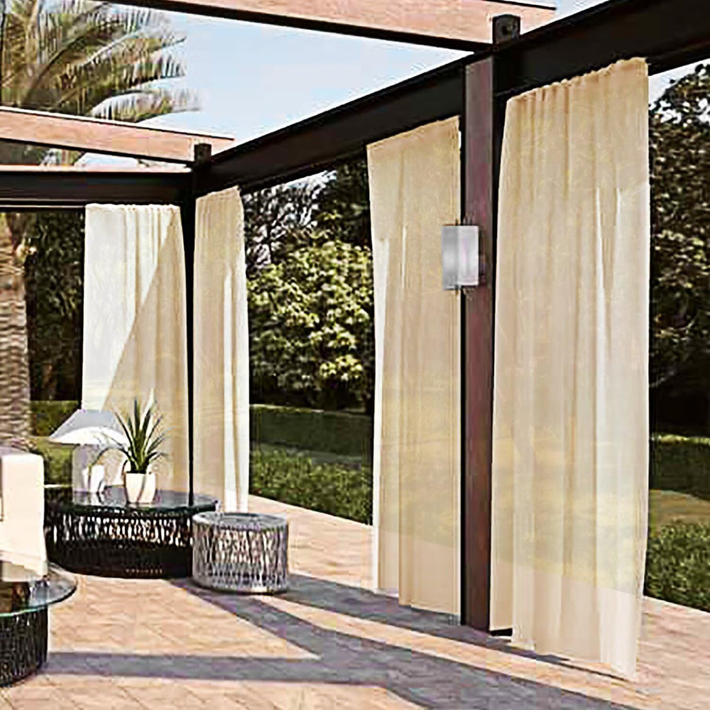 SpaceDresser Outdoor Sheer Curtain beige panel in outdoor setting