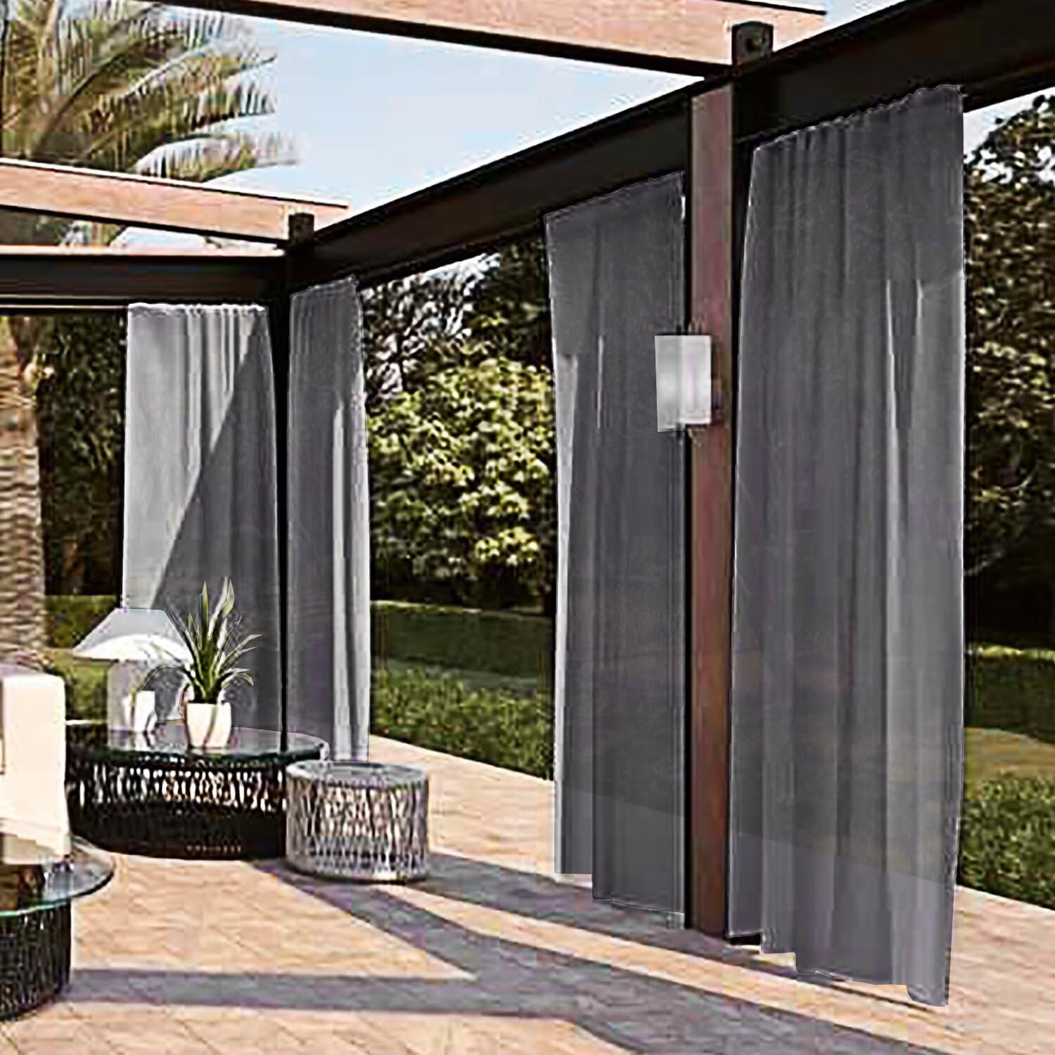 SpaceDresser Outdoor Sheer Curtains Grey hanging on patio