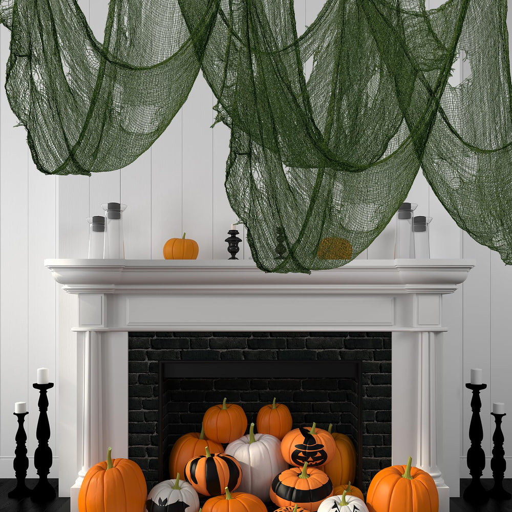 Spooky Halloween setup with green creepy cloth and decorations