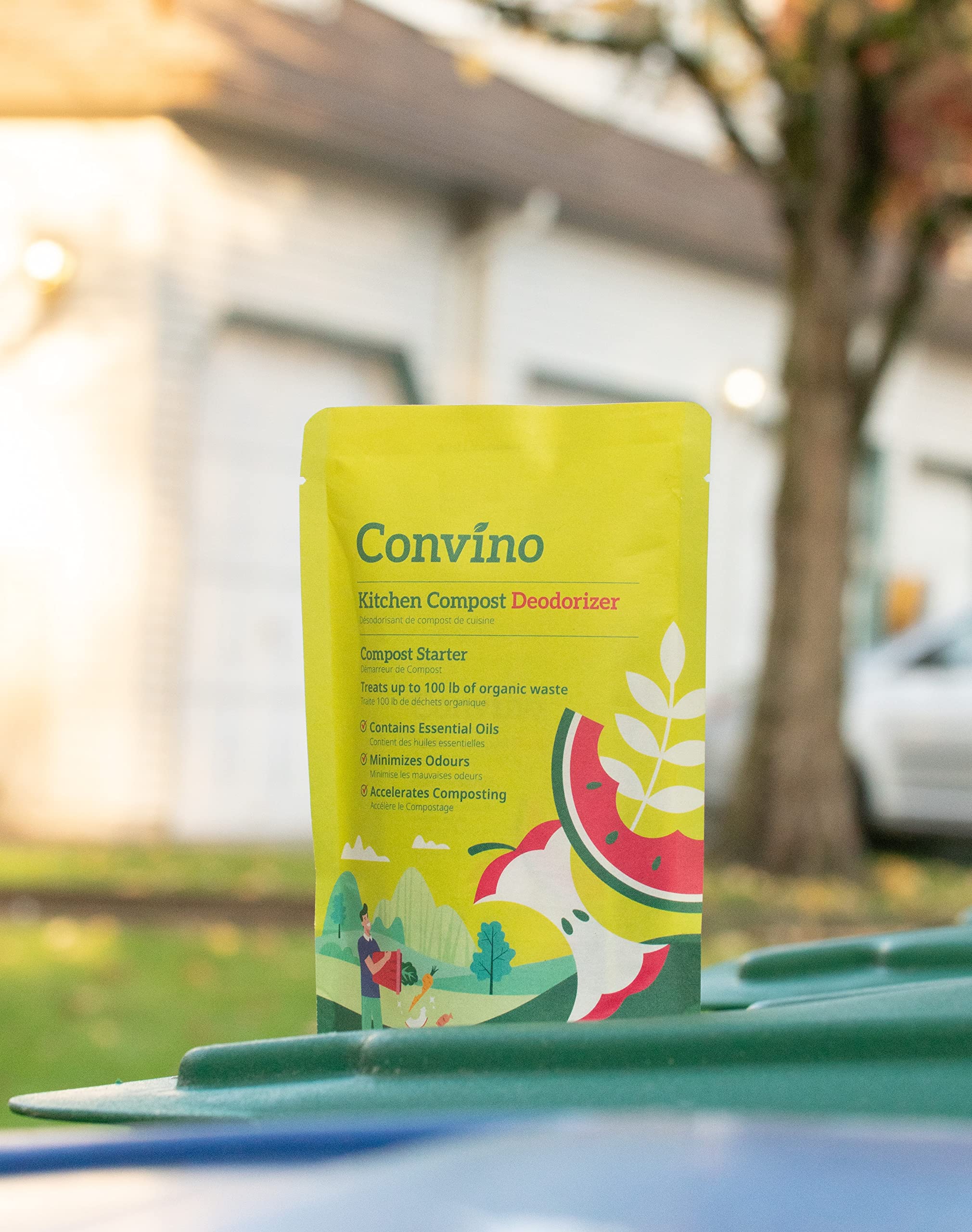 Spreading Convino Compost Starter in garden soil