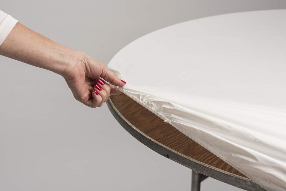 Stack of Kwik-Covers table covers, white colour