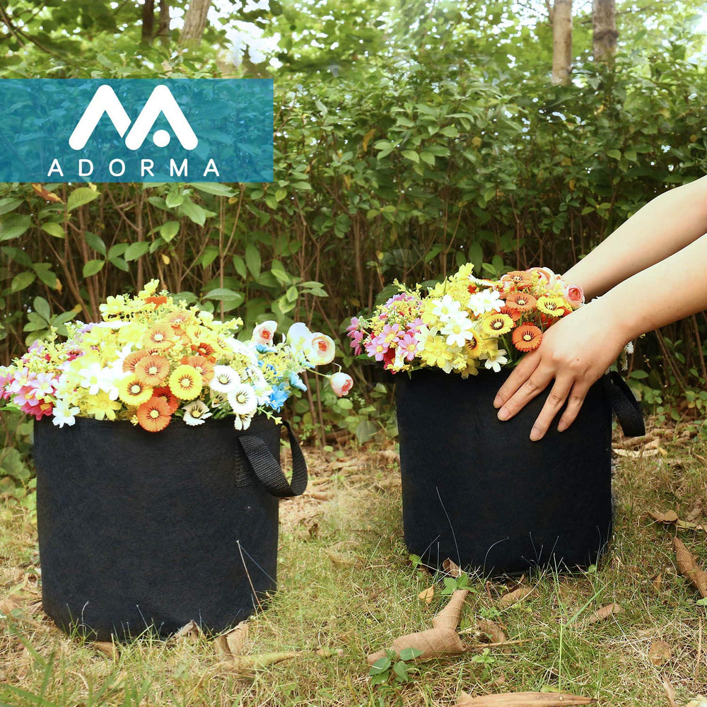Stacked ADORMA grow bags ready for planting