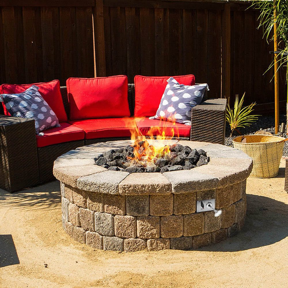 Stanbroil gas valve key being used in outdoor fire pit