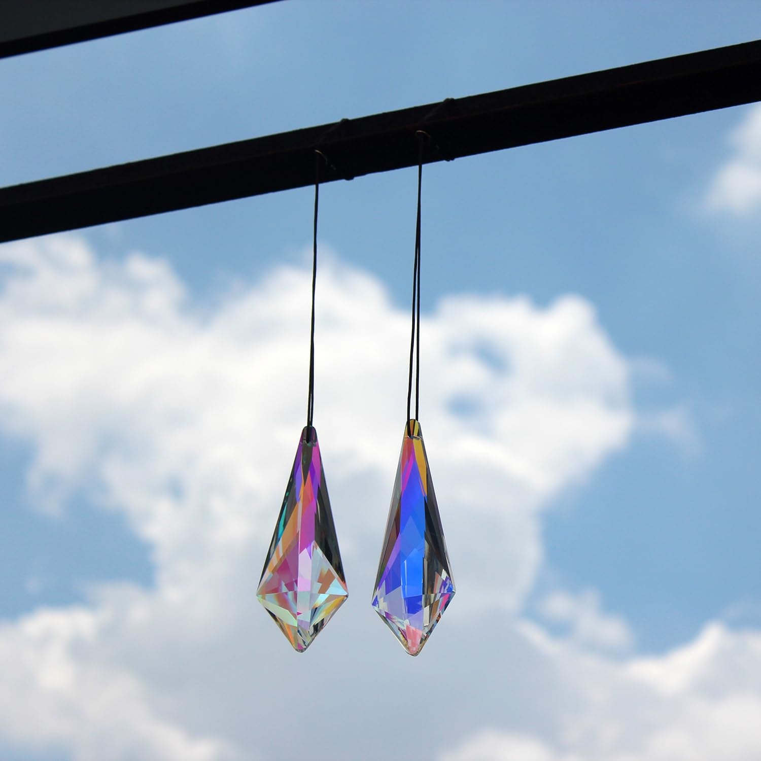 stino Cone Crystal Suncatcher Prisms displayed on a window sill
