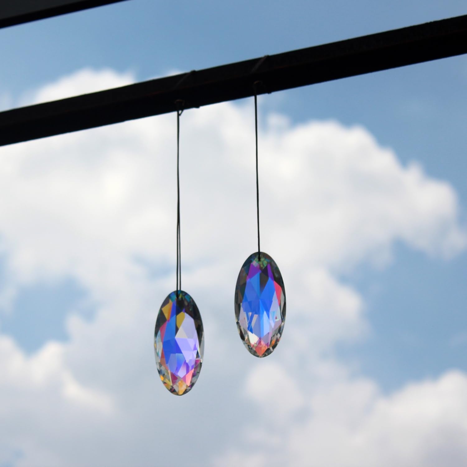 stino Eye Crystal Suncatcher displayed in a window