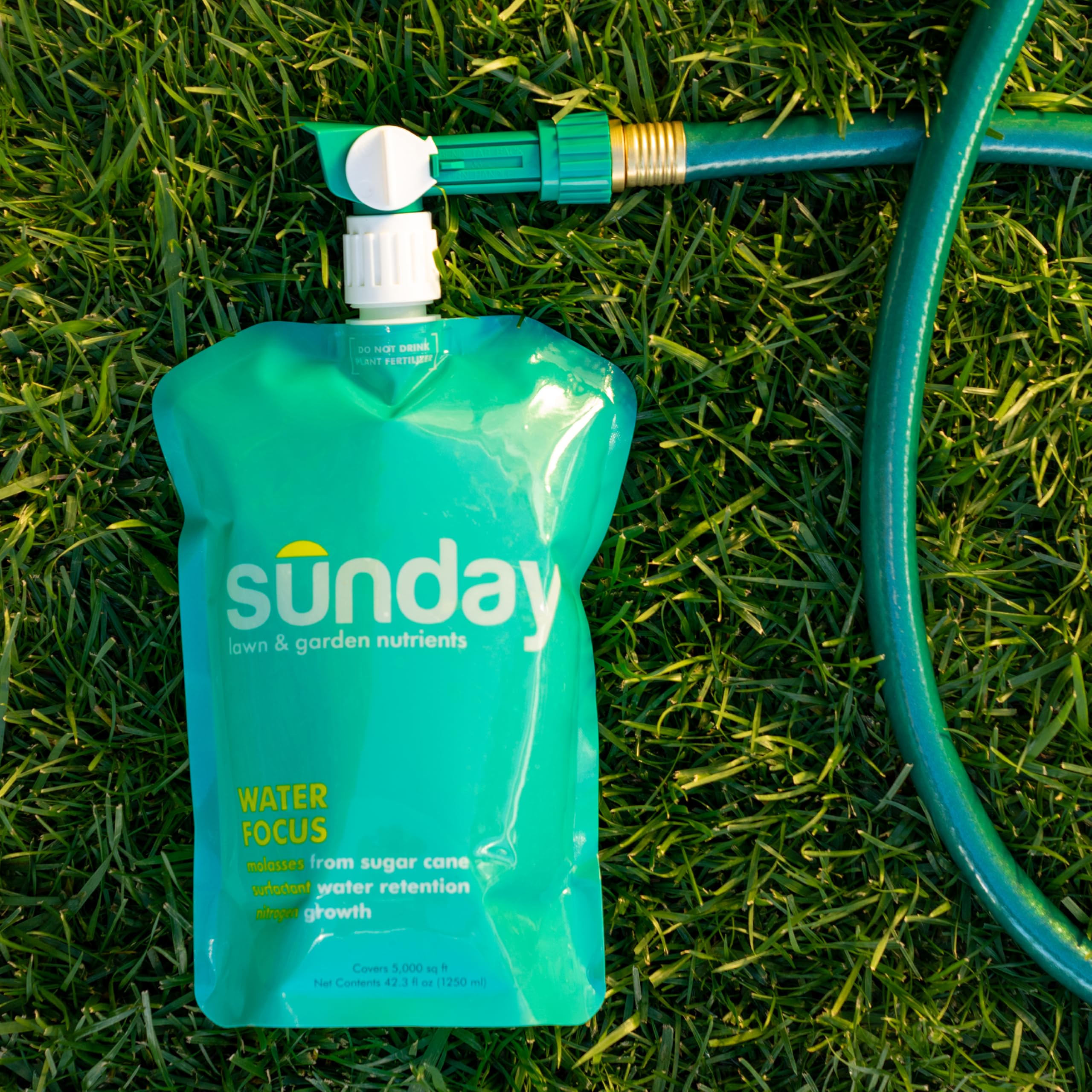 SUNDAY Liquid Lawn Fertilizer in use on lawn