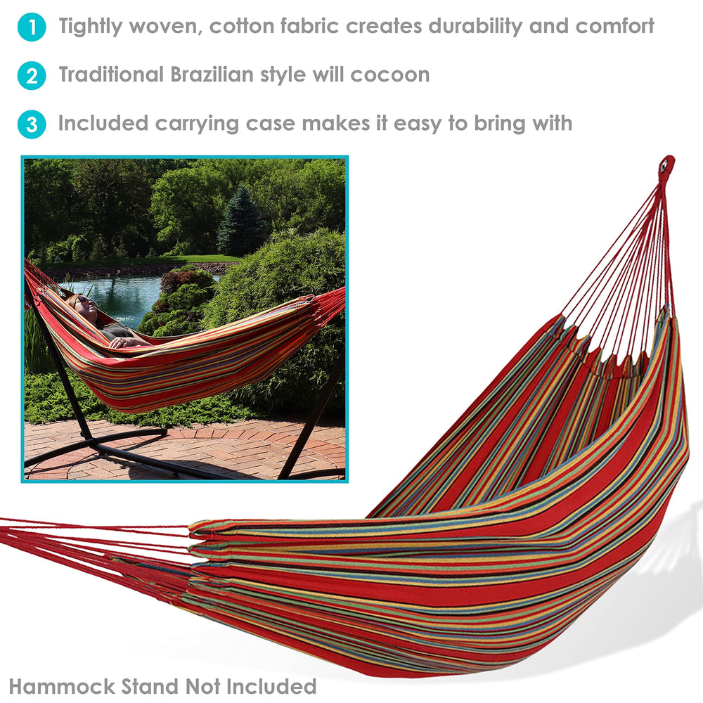 Sunnydaze Brazilian Double Hammock hanging between trees
