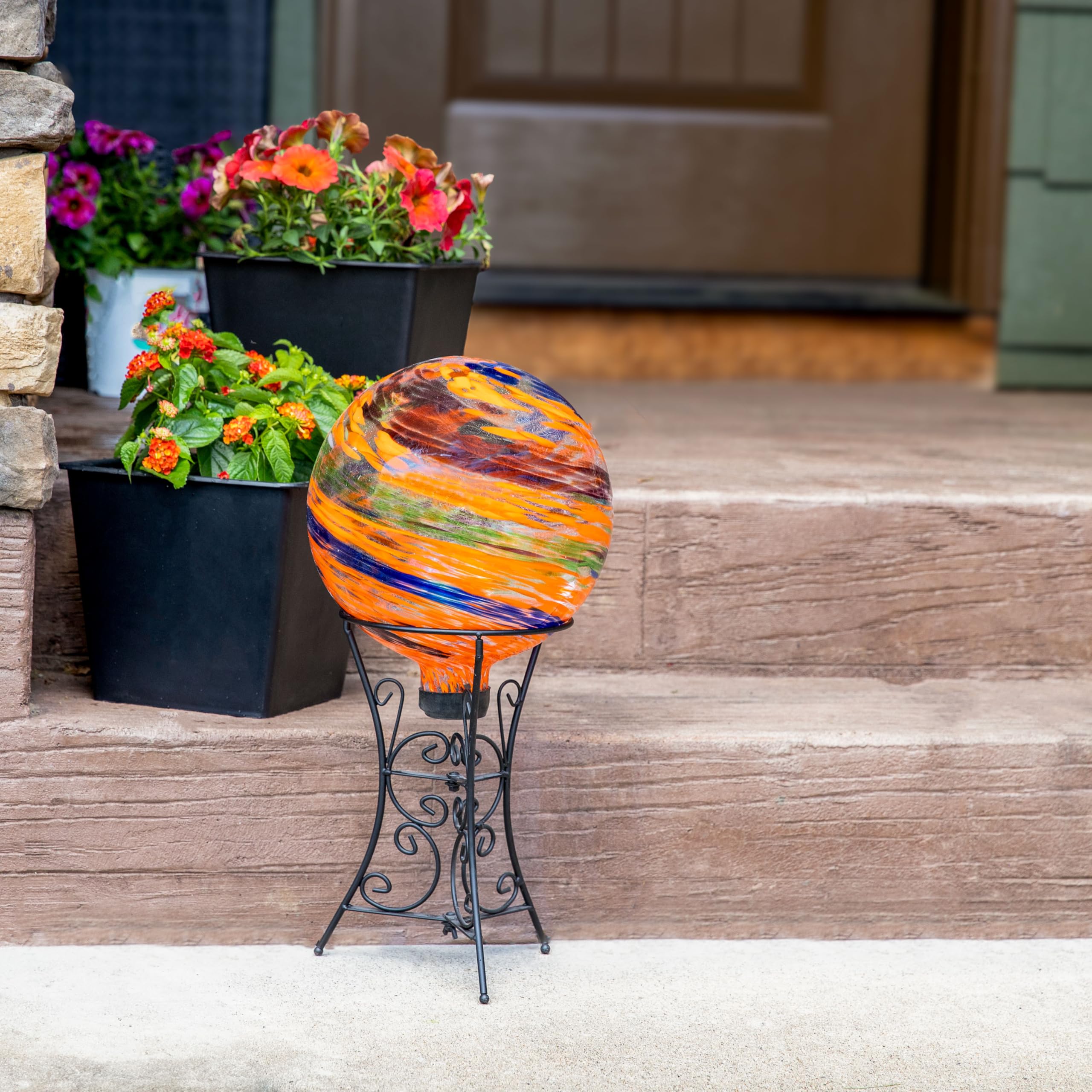 Sunnydaze Gazing Ball displayed in a festive garden setting