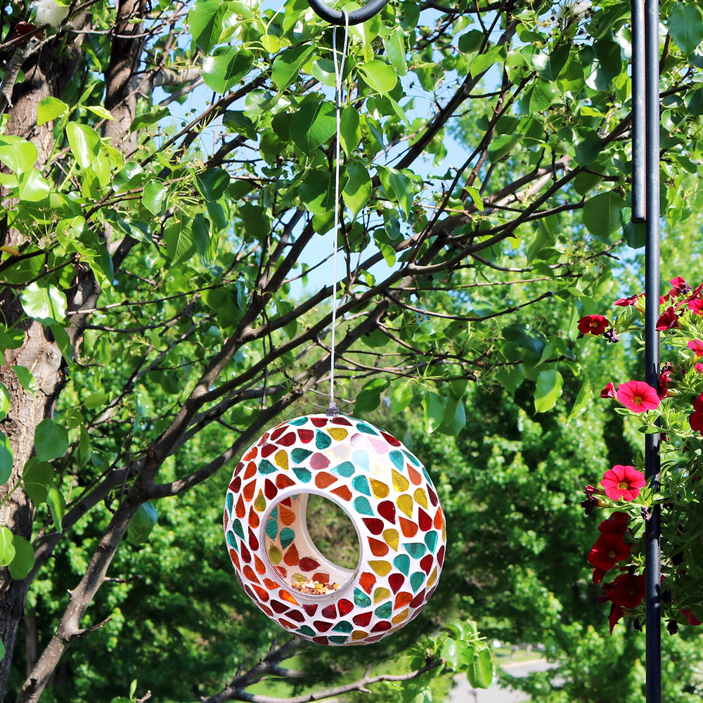 Sunnydaze Mosaic Glass Bird Feeder hanging from a tree branch