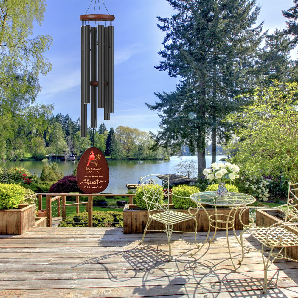 Suntimber Memorial Wind Chimes displayed on a patio railing