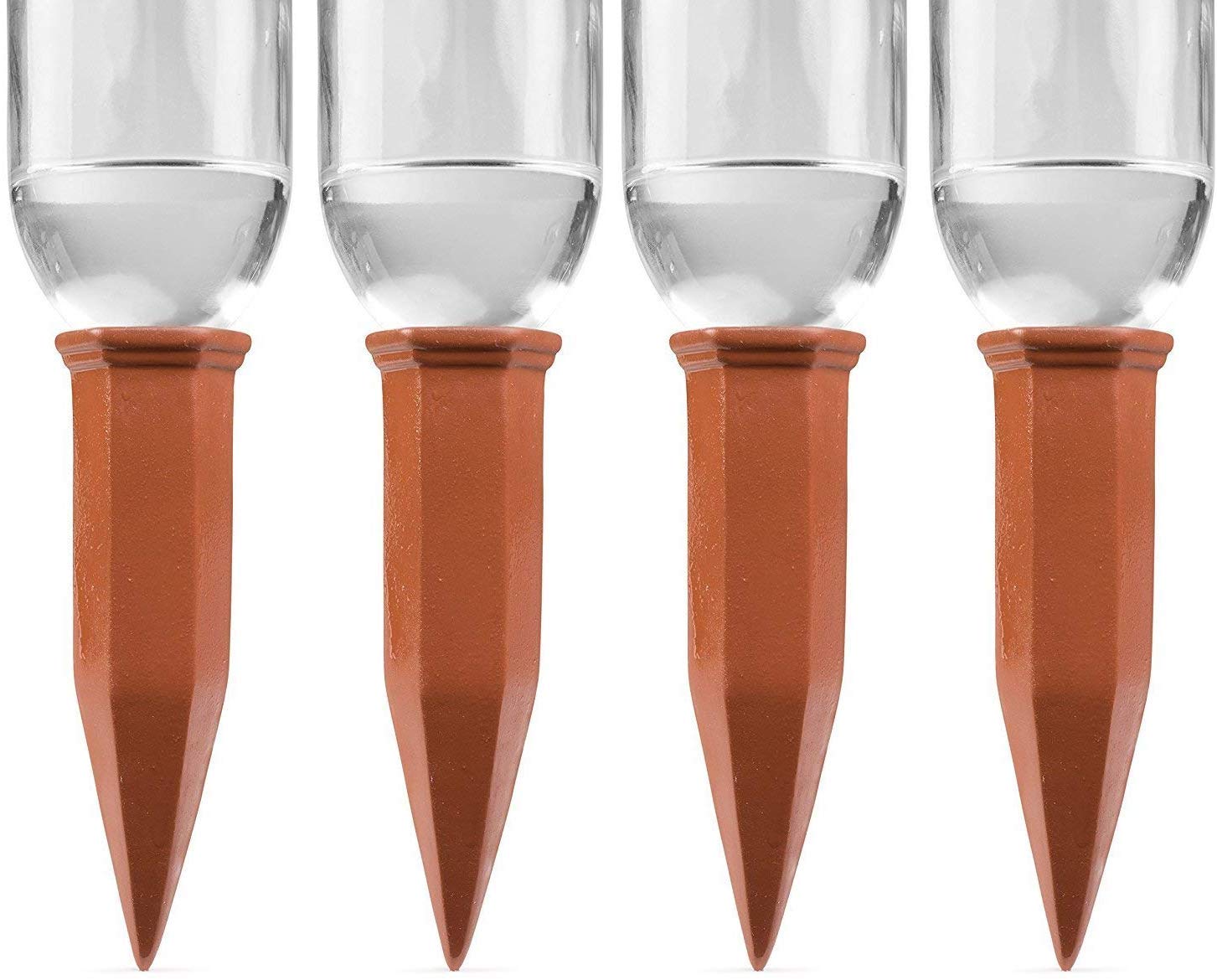 Terracotta self-watering stake inserted in a plant soil