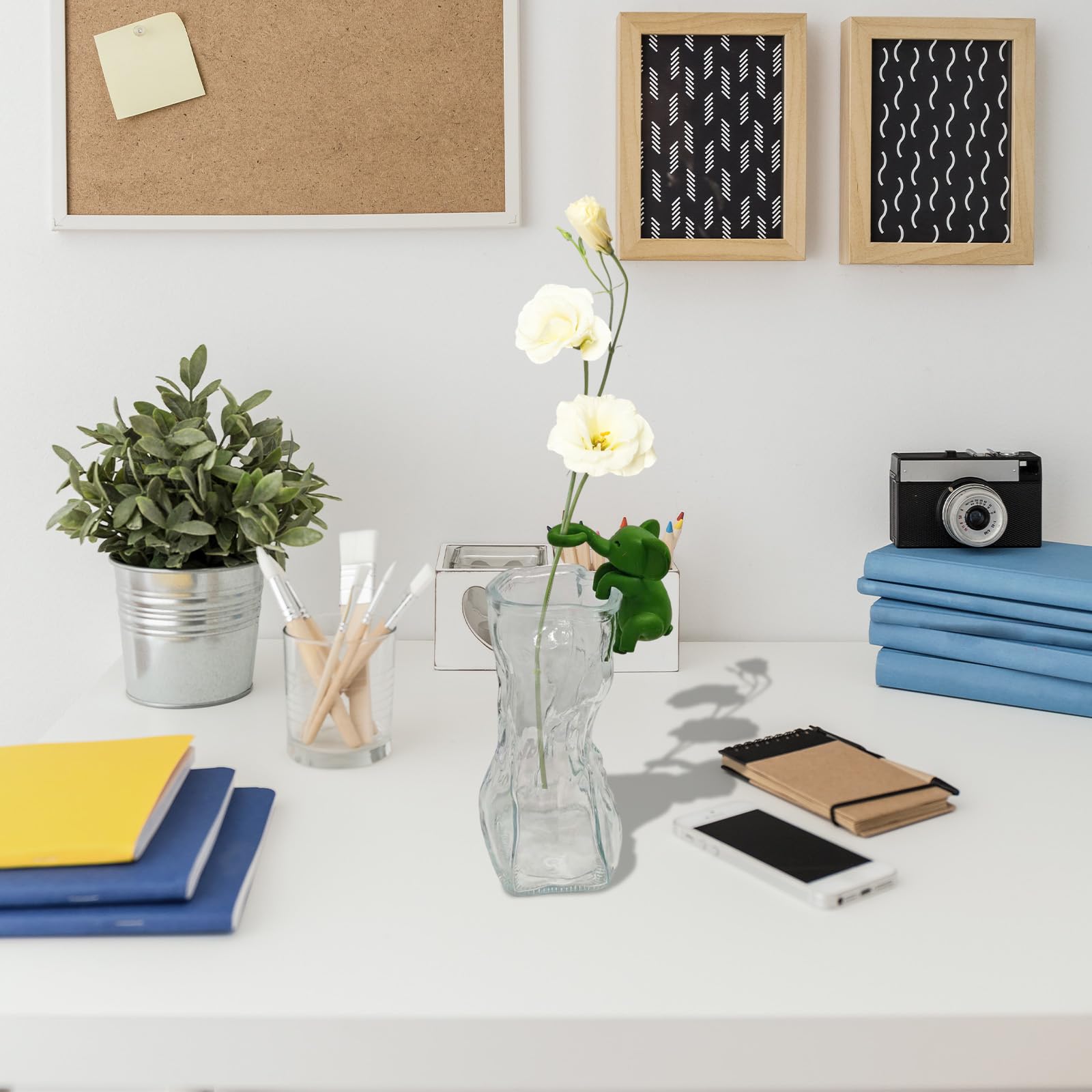 Three IVTLIF VVV Elephant Plant Cutting Holders on a desk
