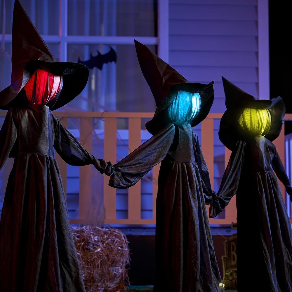 Three JOYIN Halloween witches displayed in a yard