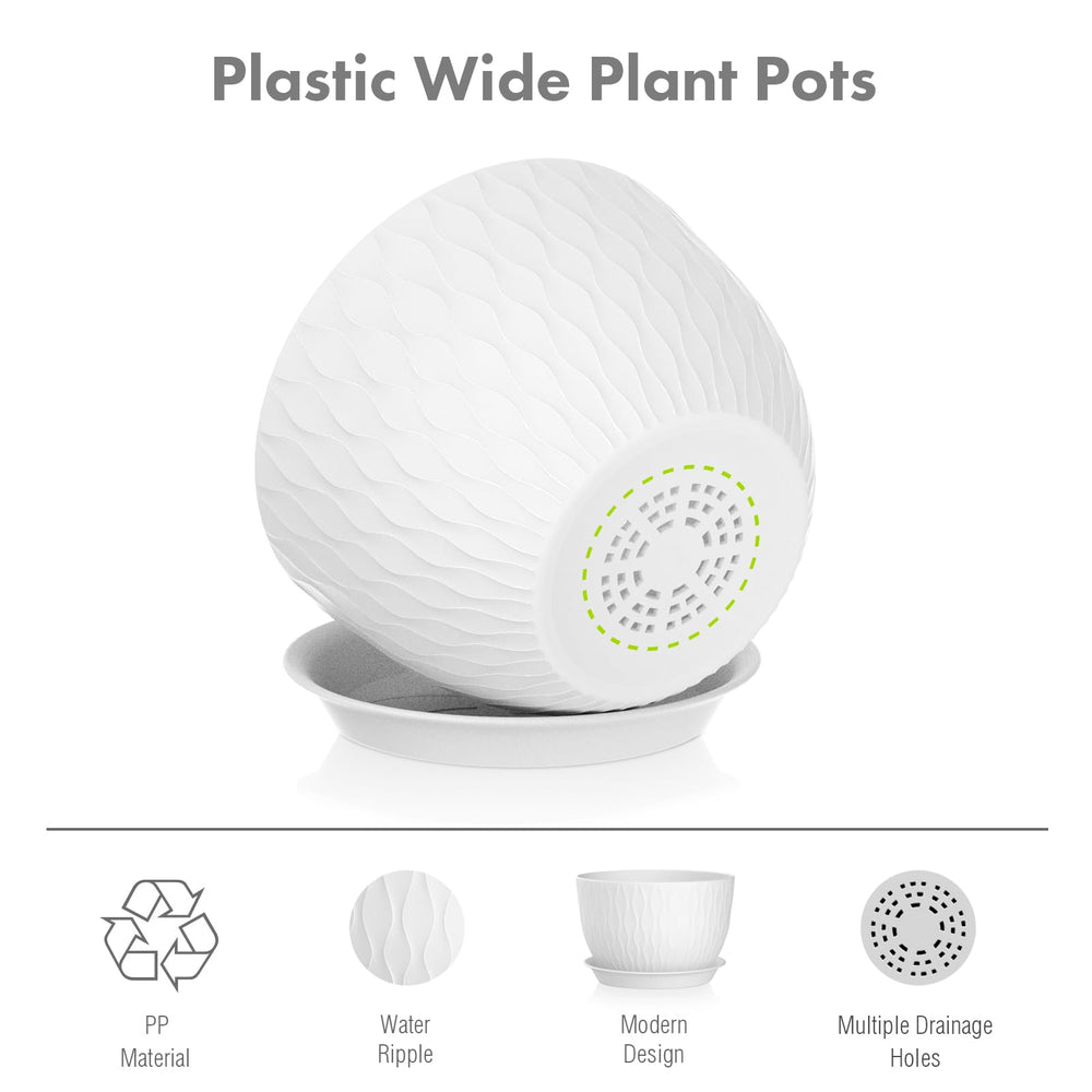 Three Meowell plant pots of varying sizes on a patio