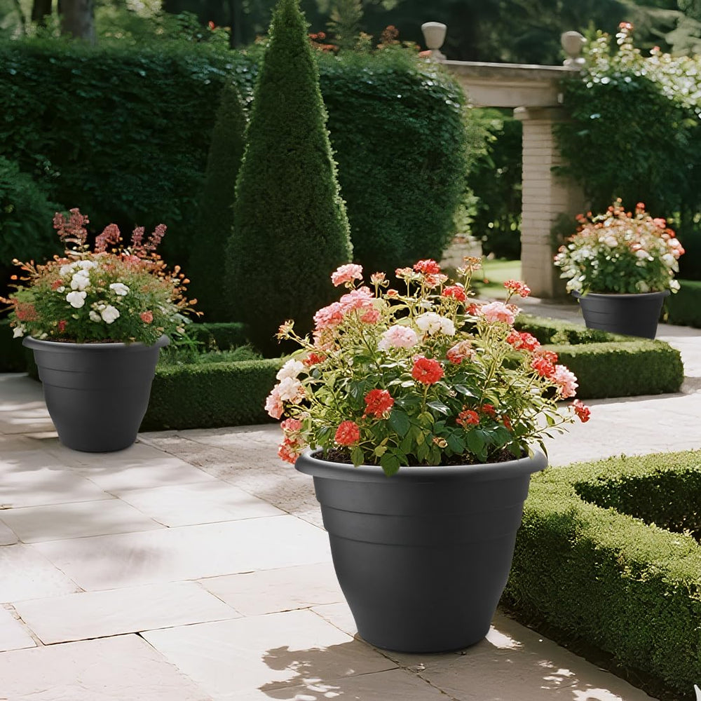 Three RooTrimmer 20 Inch Large Plant Pots arranged in a garden