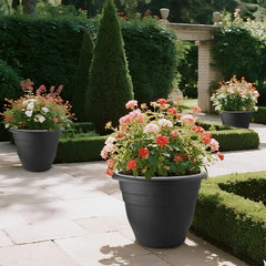 Three RooTrimmer 20 Inch Large Plant Pots arranged in a garden
