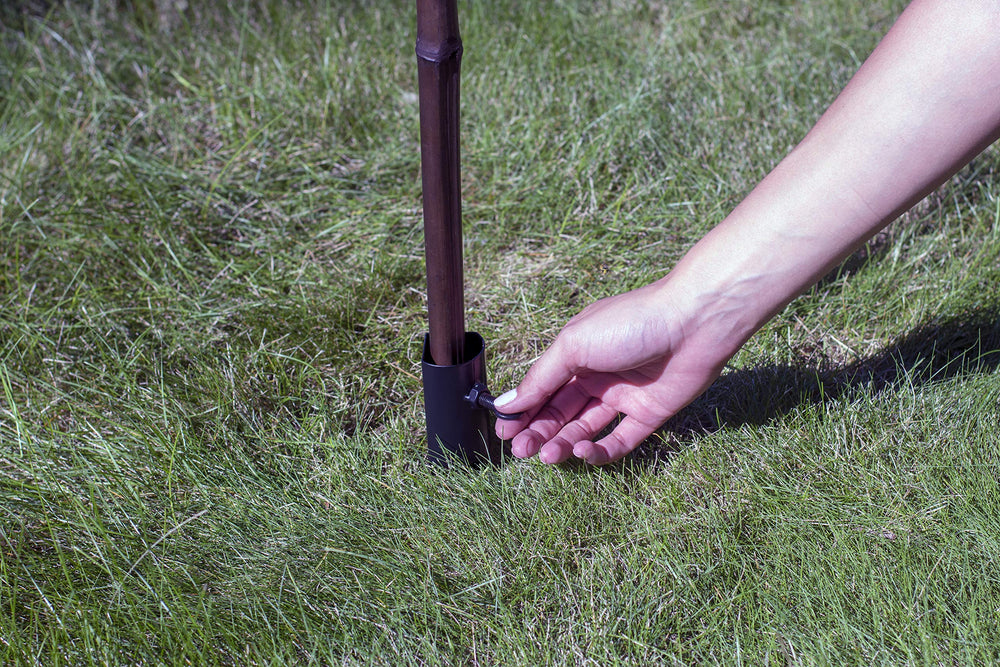 TIKI Metal Torch Stakes pack of four with outdoor setting