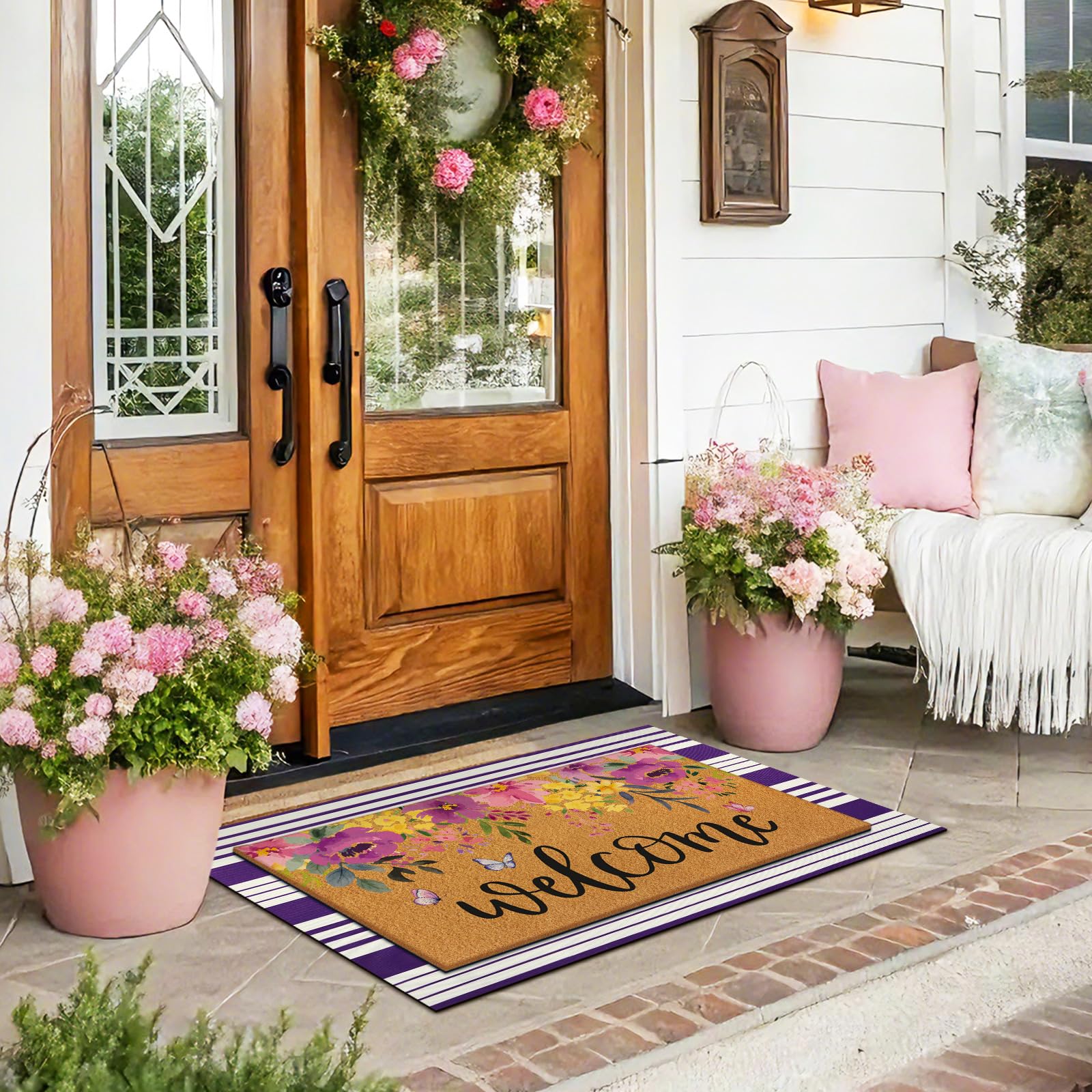 Tinideya welcome doormat on a porch with winter decorations
