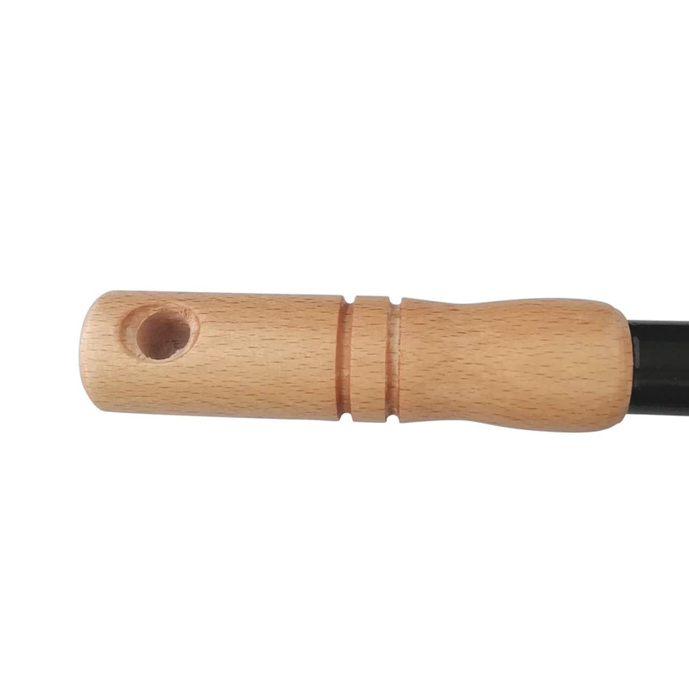 Tomerry sickle in use for cutting grass in garden