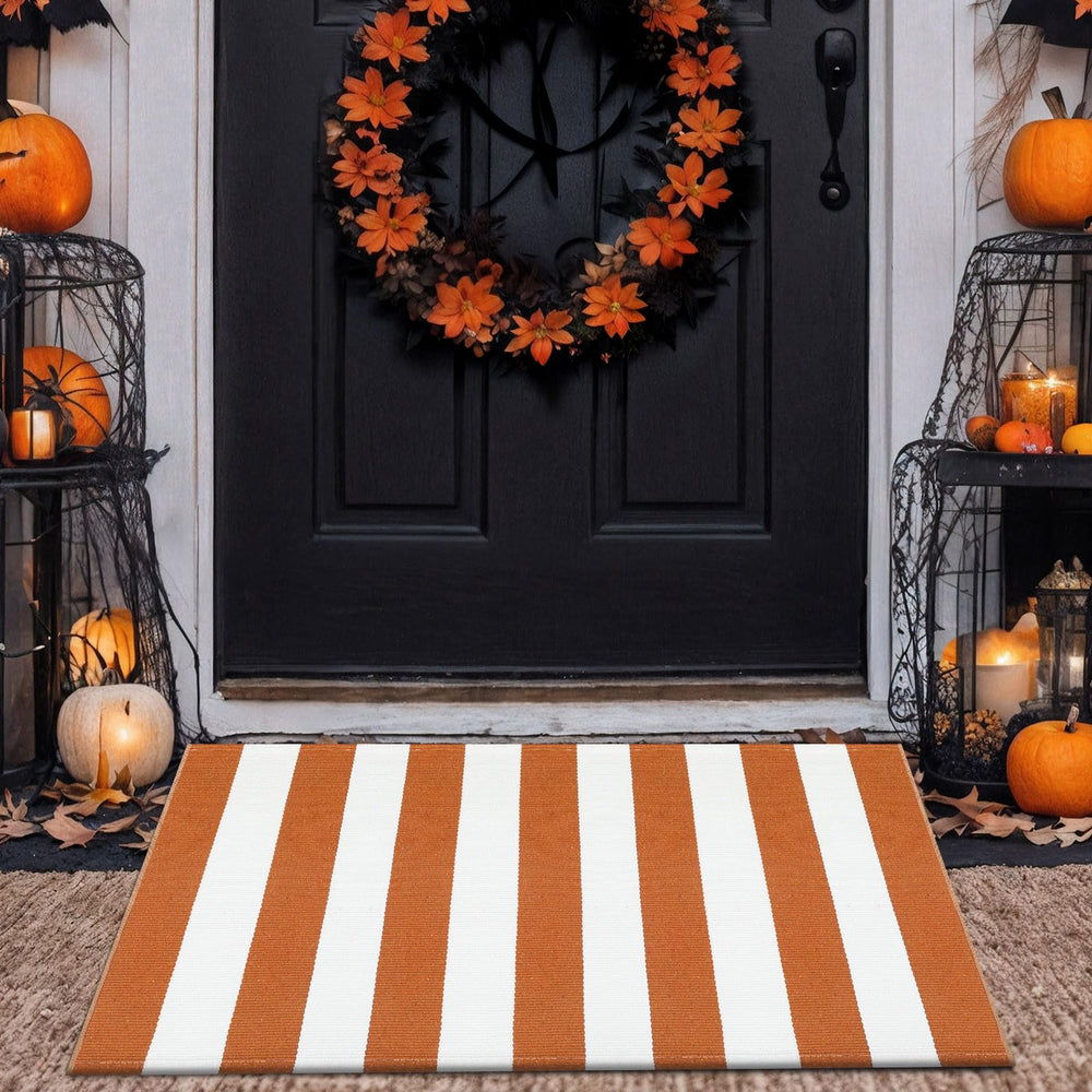 Top view of rust brown stripe layering door mat