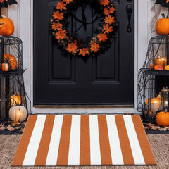 Top view of rust brown stripe layering door mat