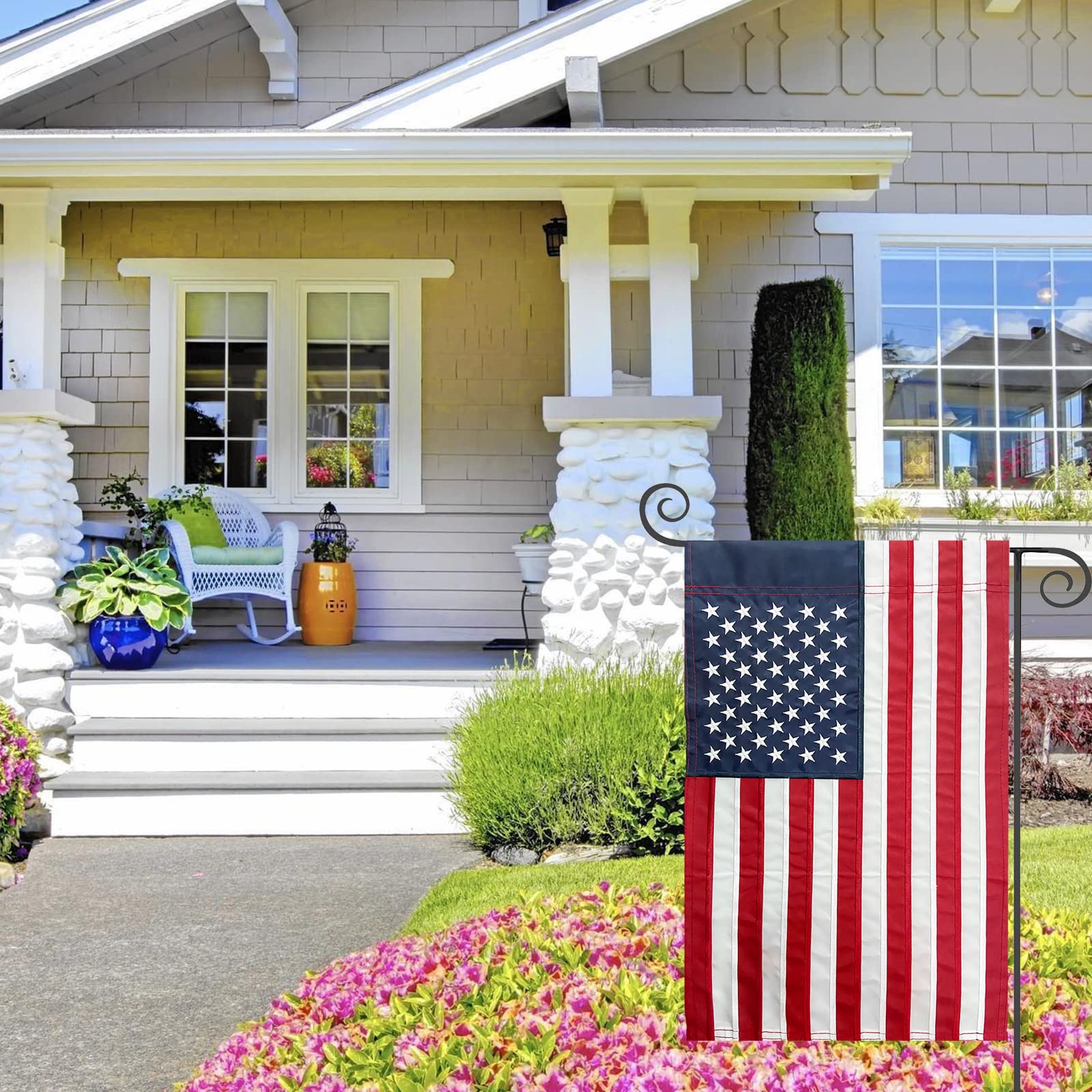 TOPFLAGS American Flag Garden Flag hanging on a porch