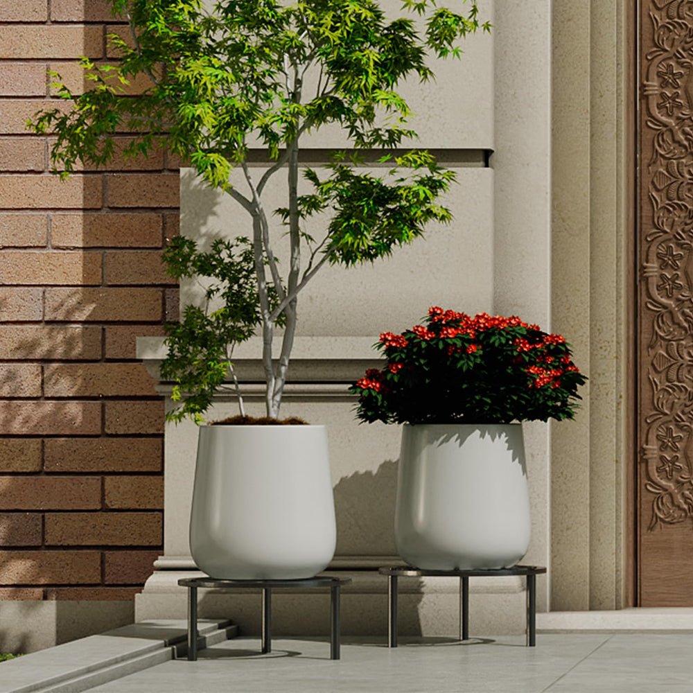 TOSKING Small Metal Plant Stand next to various plant pots