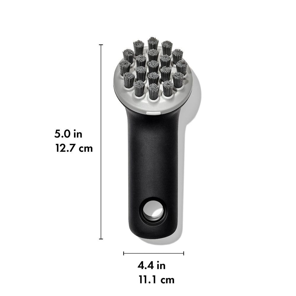 Tough scraper tip of OXO Cast Iron Scrub Brush