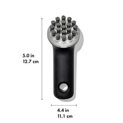 Tough scraper tip of OXO Cast Iron Scrub Brush