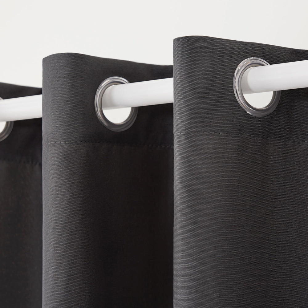 TOWN & COUNTRY BASICS Cabana Heavyweight Curtains hanging on a patio