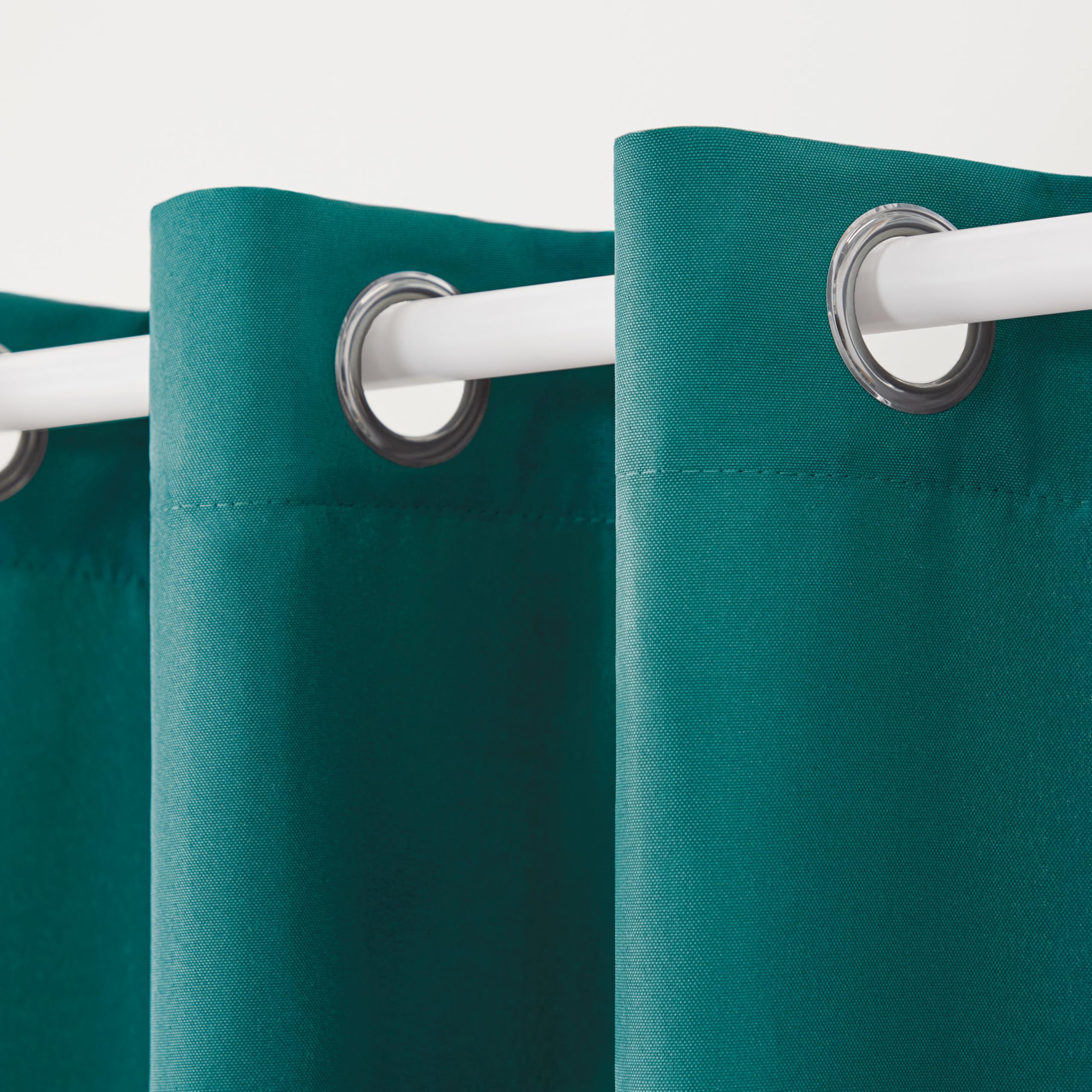 TOWN & COUNTRY BASICS Cabana Solid Heavyweight Outdoor Curtains, hanging on patio