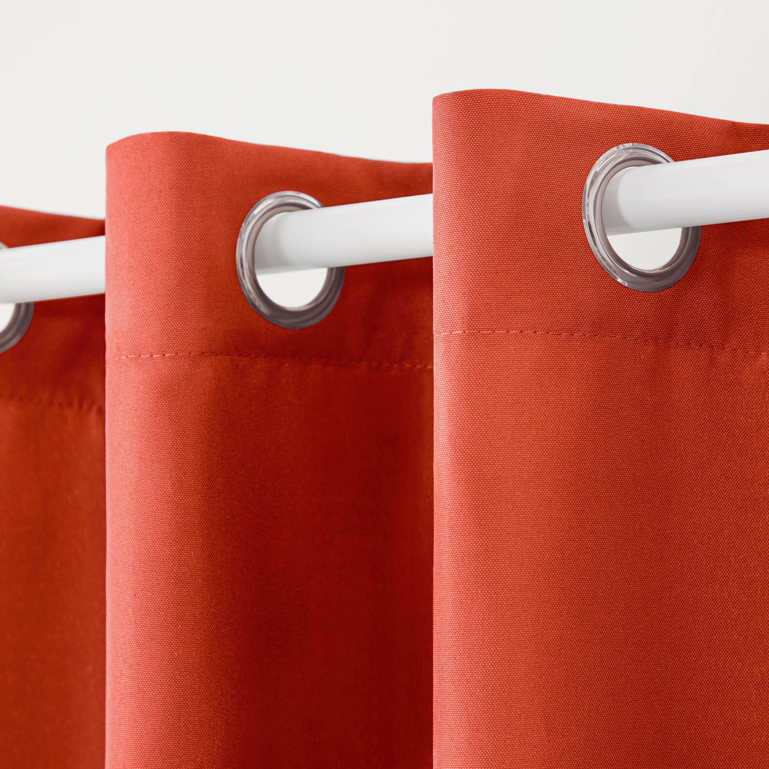 TOWN & COUNTRY BASICS curtains displayed on a patio