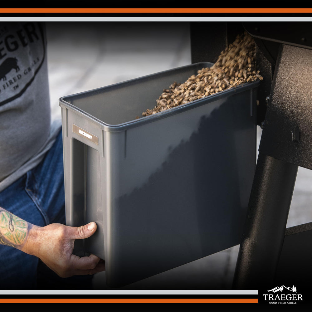 Traeger Stay Dry Pellet Storage Bin holding Traeger wood pellets