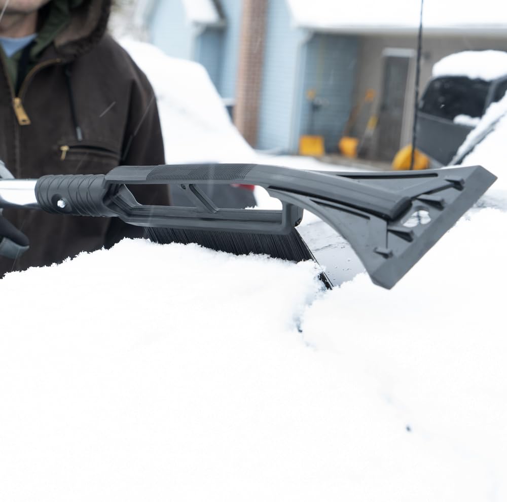TRUE TEMPER shovel in use on a snowy driveway