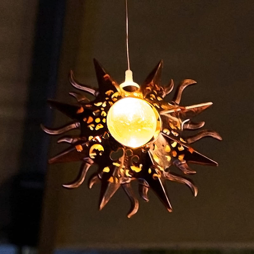 Tryme Solar Wind Chimes during nighttime glow