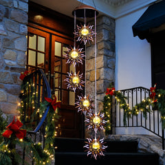 Tryme Solar Wind Chimes hanging in a garden