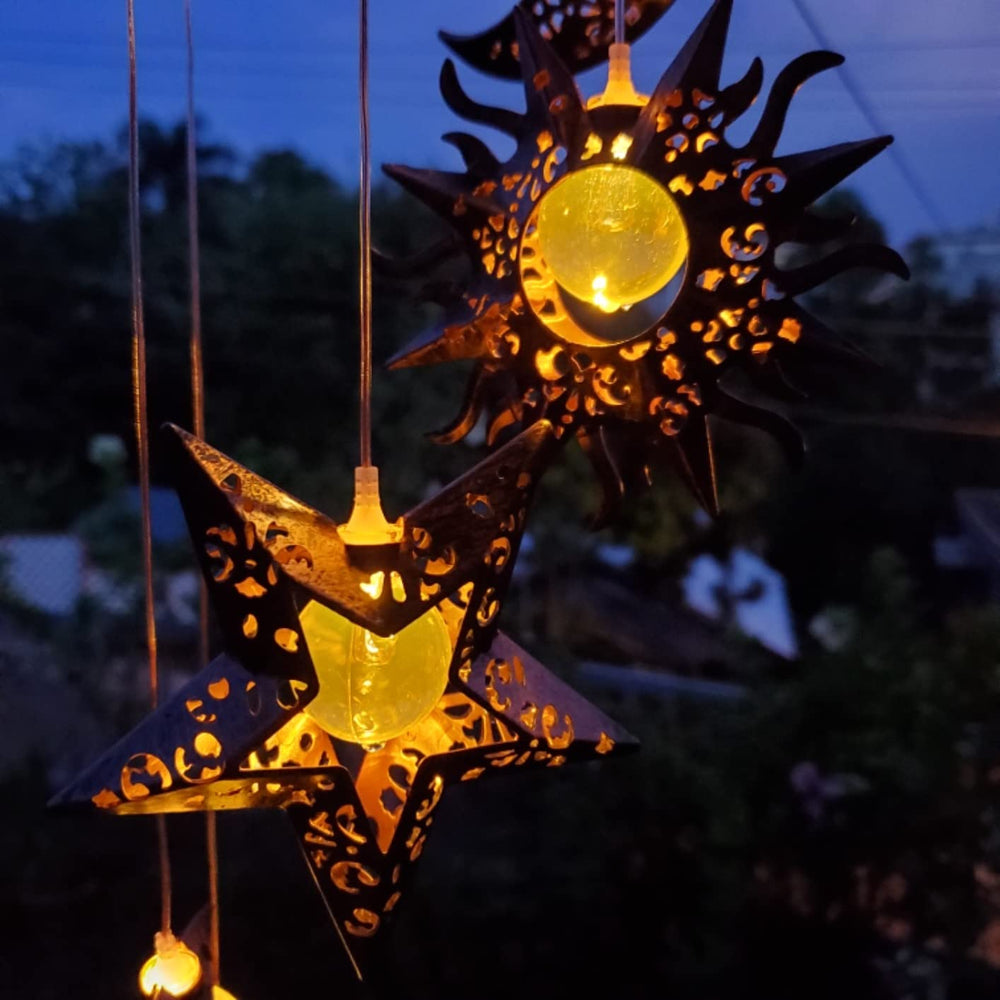 Tryme Solar Wind Chimes hanging in a garden