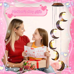 Tryme Solar Wind Chimes hanging in a garden setting