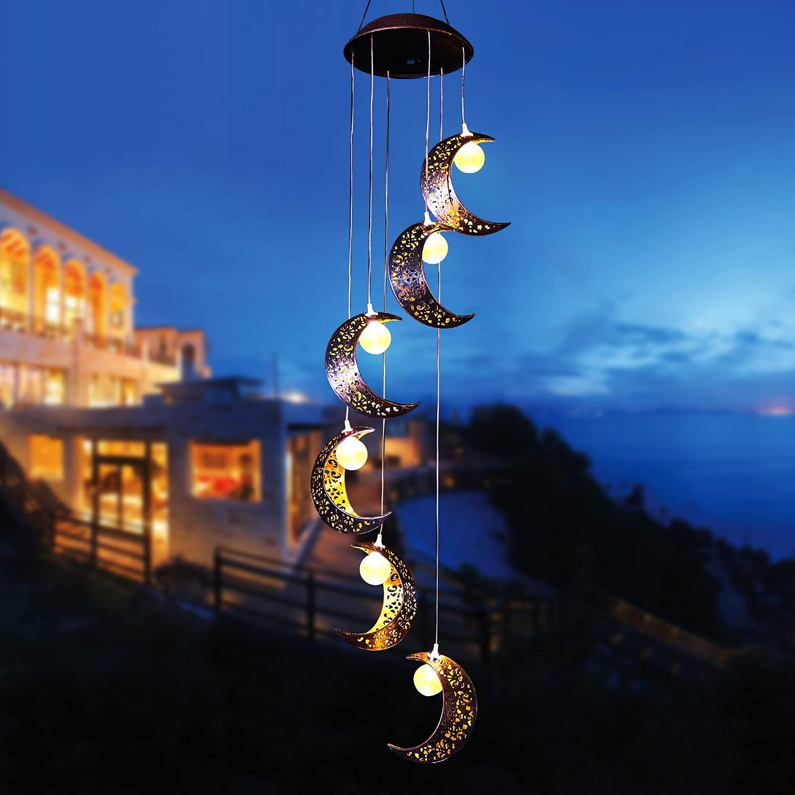 Tryme Solar Wind Chimes illuminated at night