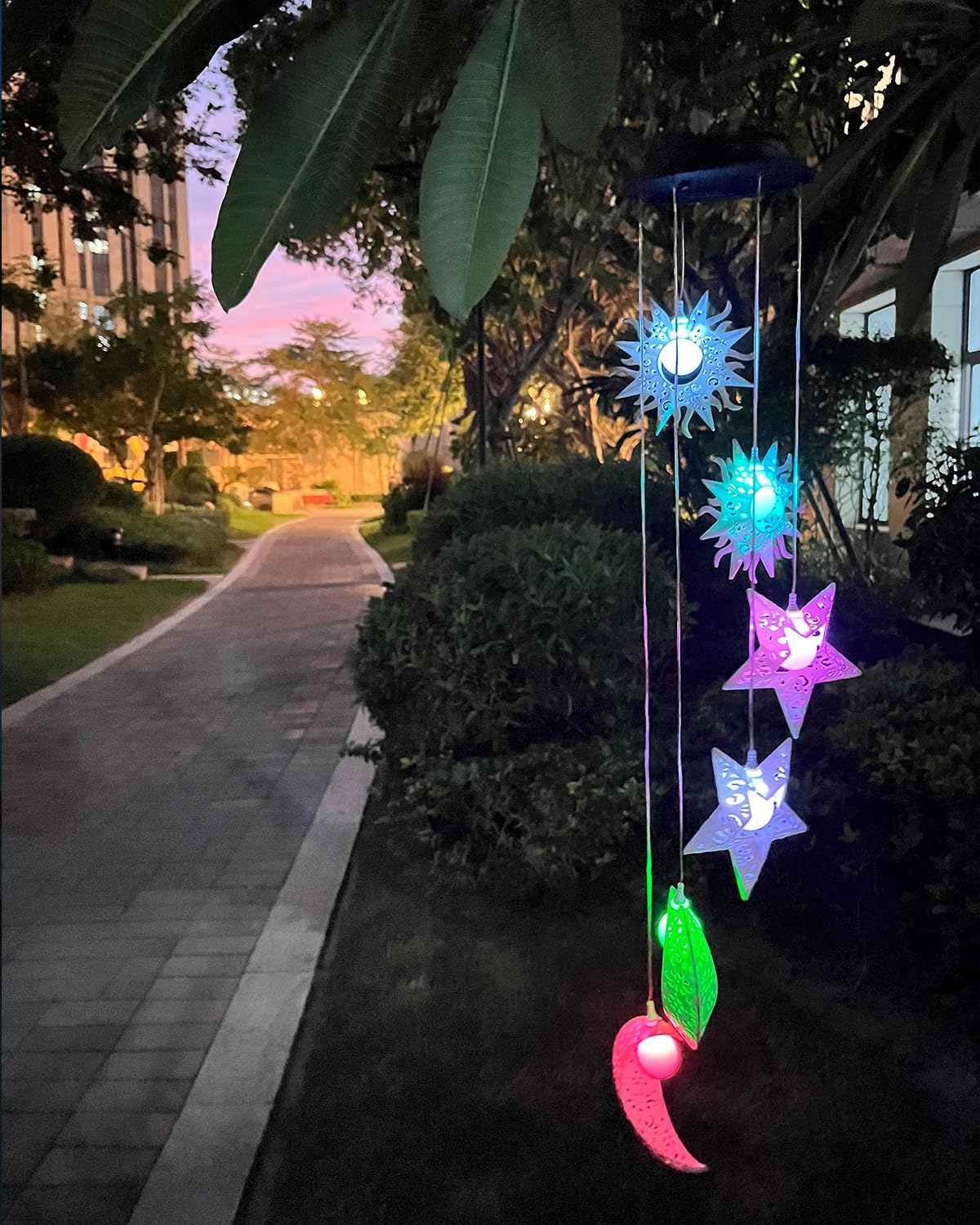 Tryme Solar Wind Chimes with vibrant colors at night
