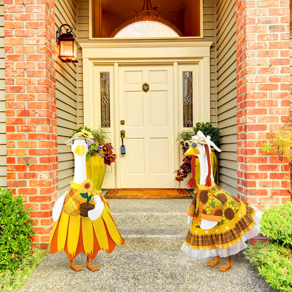 Two Abbylike sunflower porch goose outfits displayed together