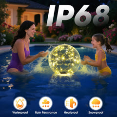 Two Askyli floating pool lights illuminating a garden