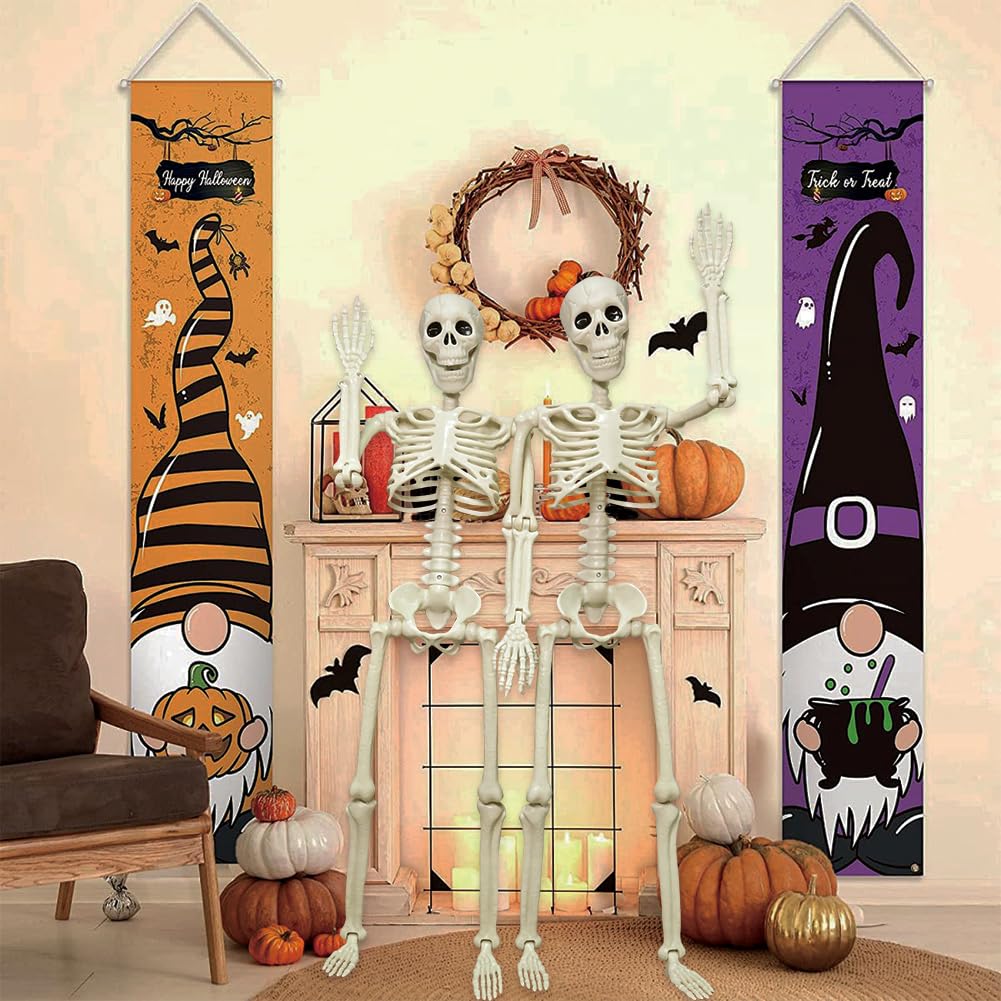 Two CAMIRUS plastic skeletons in a spooky setting